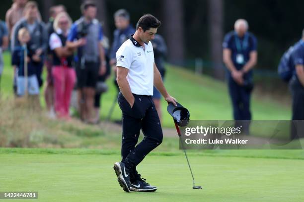 Viktor Hovland of Norway pays their respects as play stops for a two minute silence in memory of Her Majesty, Queen Elizabeth II, during Round Two on...