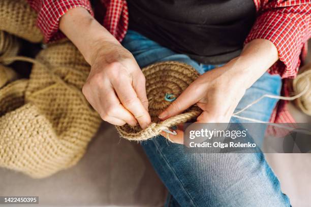 knitting business as freelancer. woman hands use knitting needle, knitting clothes and decorations - かぎ針編み ストックフォトと画像