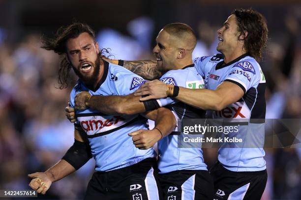 Toby Rudolf of the Sharks celebrates with team mates after scoring a try during the NRL Qualifying Final match between the Cronulla Sharks and the...