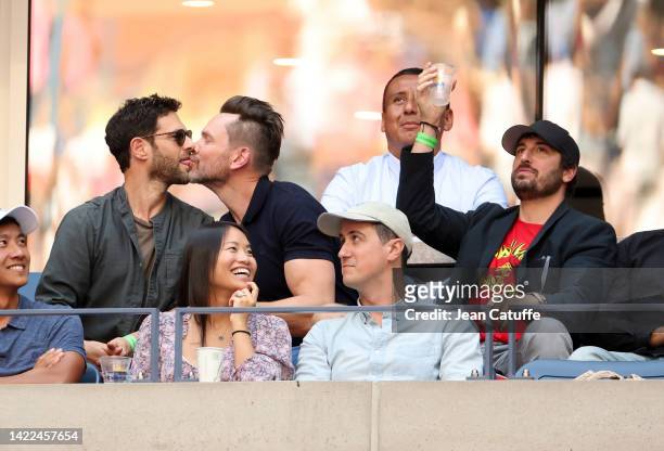 Justin Bartha kissing Joel McHale on the lips, Jason Biggs - when shown on the big TV screen - attend day 12 of the US Open 2022, 4th Grand Slam of...