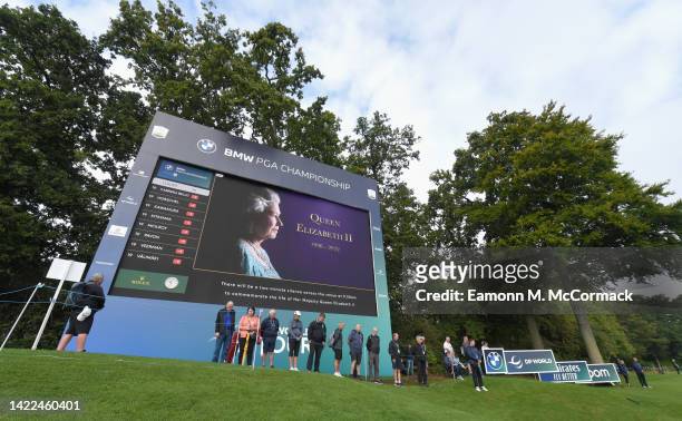 General view as the LED Screen displays an image of Her Majesty, Queen Elizabeth II, as competitors and spectators pause for a two minute silence...