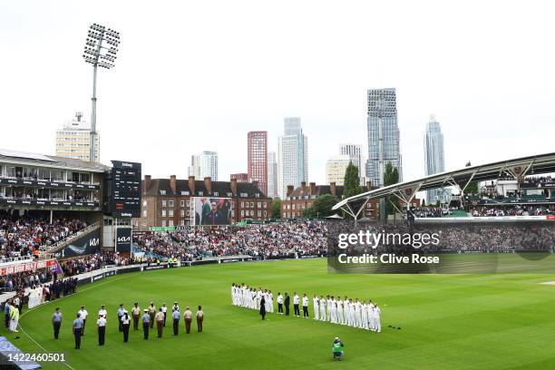 Players and spectators observe a minute silence, as LED boards around the stadium pay tribute to Her Majesty Queen Elizabeth II during Day Three of...