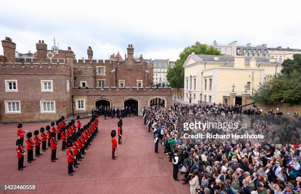 Members of the Coldstream guards line up ahead of the watching public as the Principal Proclamation is read from the balcony overlooking Friary Court...