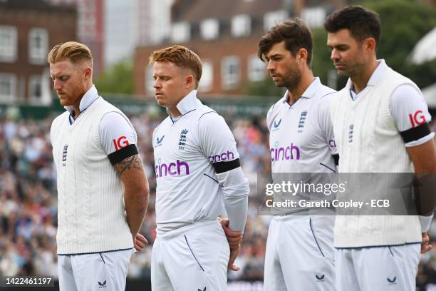 Ben Stokes, Ollie Pope, Ben Foakes and James Anderson of England look on during a minutes silence as a tribute to Her Majesty Queen Elizabeth II...