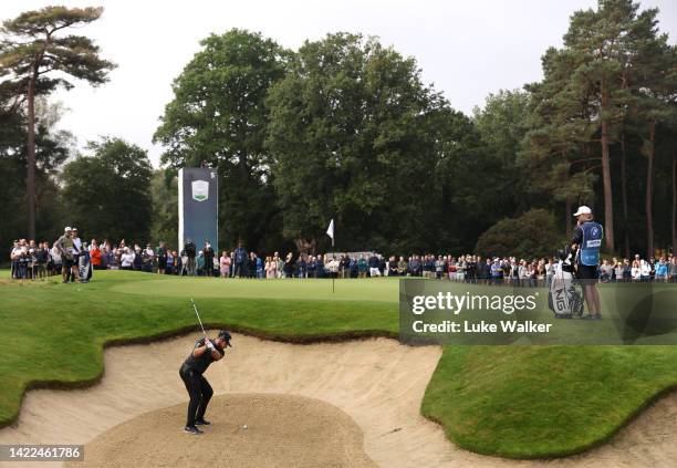 Tyrrell Hatton of England plays out of a bunker on the 5th green during Round Two on Day Three of the BMW PGA Championship at Wentworth Golf Club on...