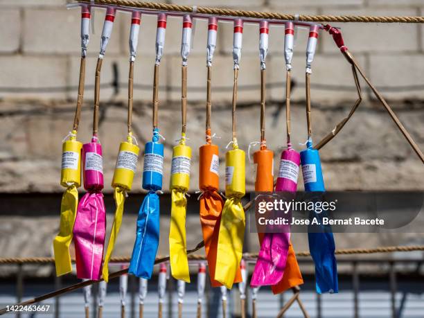 large rockets prepared for a daytime fireworks display, pyrotechnic show called "mascleta". - petard stock pictures, royalty-free photos & images