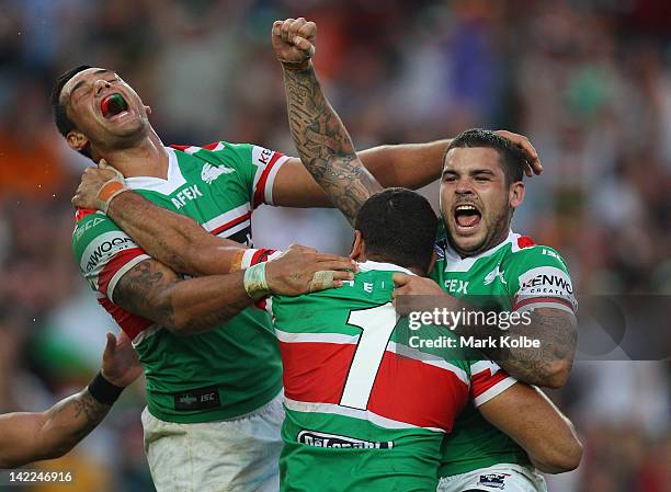 John Sutton and Adam Reynolds of the Rabbitohs celebrates golden point victory after Greg Inglis kicked a field goal during the round five NRL match...