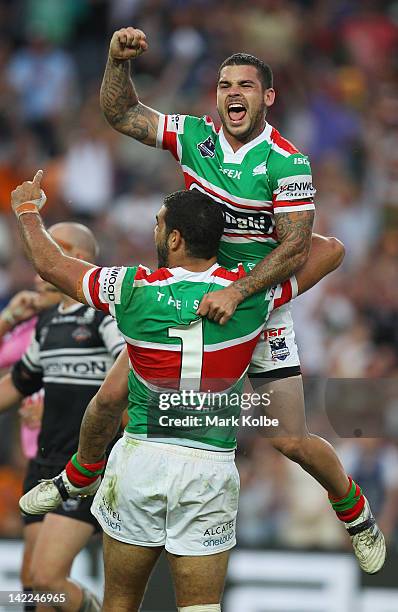 Greg Inglis and Adam Reynolds of the Rabbitohs celebrate golden point victory after Greg Inglis kicked a field goal during the round five NRL match...