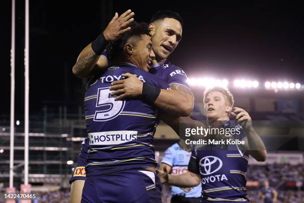 Murray Taulagi of the Cowboys celebrates with team mates after scoring a try during the NRL Qualifying Final match between the Cronulla Sharks and...