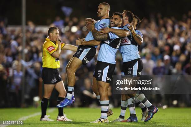 William Kennedy of the Sharks celebrates with team mates after scoring a try during the NRL Qualifying Final match between the Cronulla Sharks and...