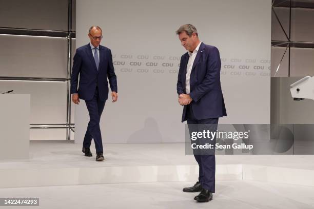 Markus Soeder , leader of the Christian Social Union , the Bavarian sister party of the German Christian Democrats , stands with CDU leader Friedrich...