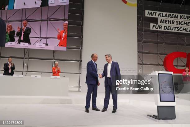 Markus Soeder , leader of the Christian Social Union , the Bavarian sister party of the German Christian Democrats , stands with CDU leader Friedrich...