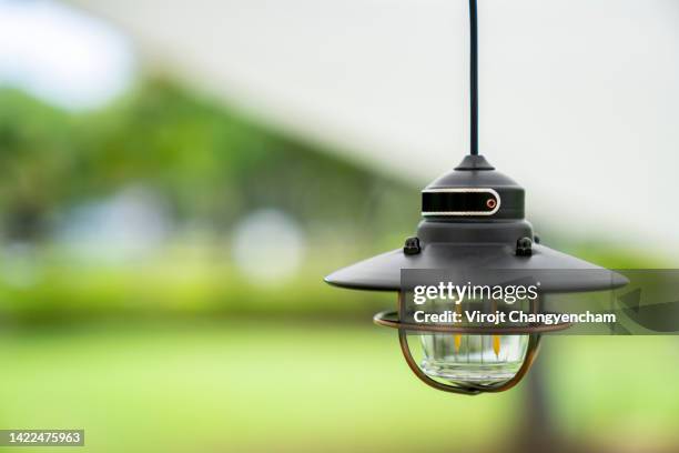 classic retro incandescent led electric lamp on blur background - fitting stockfoto's en -beelden