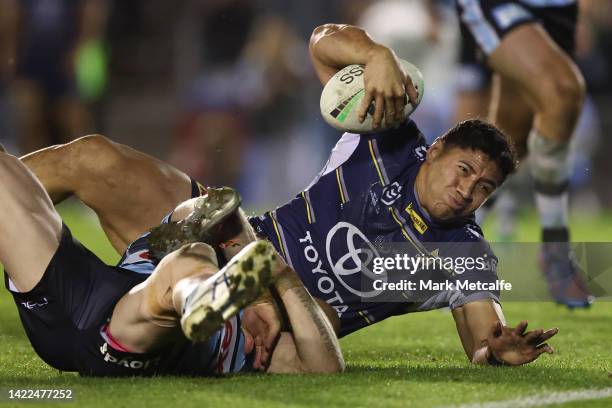 Jason Taumalolo of the Cowboys makes a break to score a try during the NRL Qualifying Final match between the Cronulla Sharks and the North...