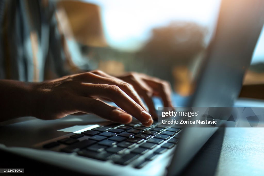 Close up of a hands on a laptop keyboard