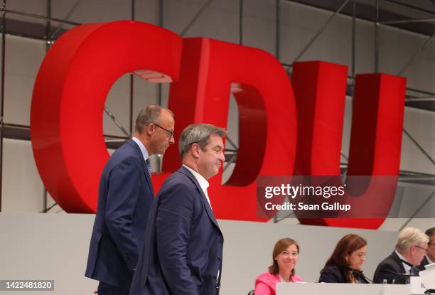 Markus Soeder , leader of the Christian Social Union , the Bavarian sister party of the German Christian Democrats , stands with CDU leader Friedrich...