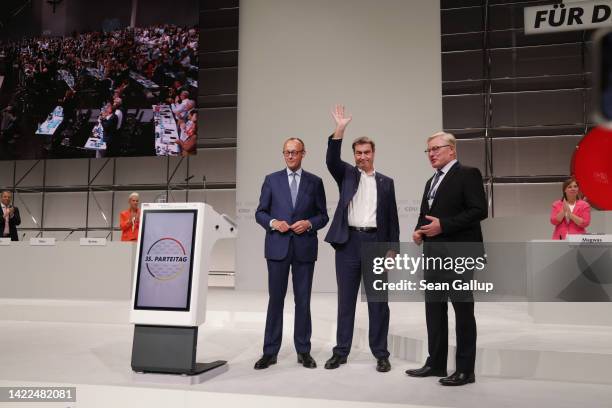 Markus Soeder , leader of the Christian Social Union , the Bavarian sister party of the German Christian Democrats , stands with CDU leader Friedrich...