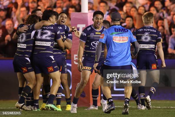 Valentine Holmes of the Cowboys celebrates with team mates after kicking the winning field goal in golden-point time during the NRL Qualifying Final...