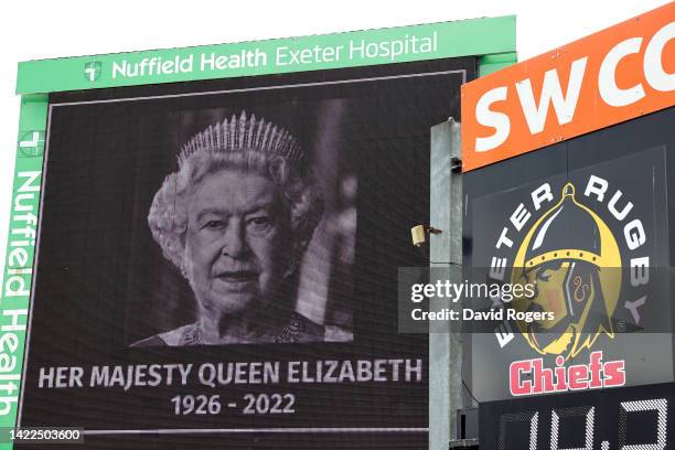 An LED board inside the stadium displays a tribute to Her Majesty Queen Elizabeth II, who died away at Balmoral Castle on September 8 prior to the...