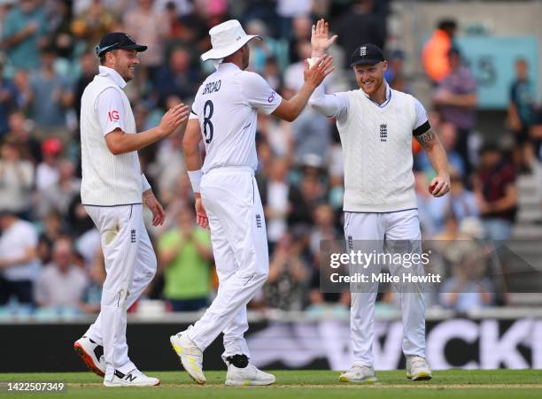 Ben Stokes celebrates the wicket of Anrich Nortje of South Africa with Stuart Broad and Ollie Robinson of England during Day Three of the Third LV=...