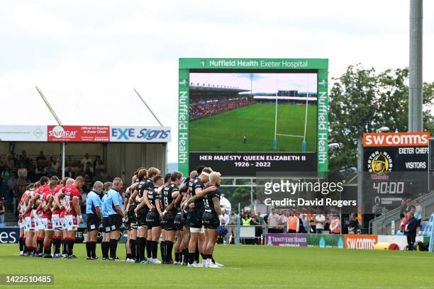 Players observe a minute silence, as an LED board inside the stadium pays tribute to Her Majesty Queen Elizabeth II, who died away at Balmoral Castle...