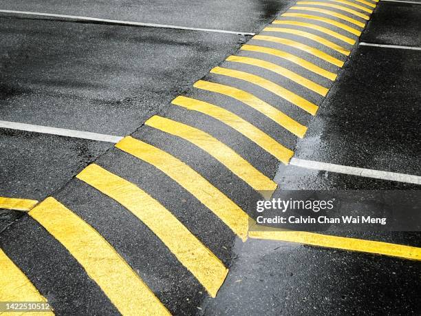 yellow color painted road speed bump - speed bump stock pictures, royalty-free photos & images