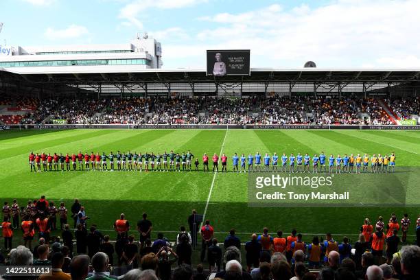 Players and spectators observe a minute silence, as LED boards around the stadium pay tribute to Her Majesty Queen Elizabeth II, who died away at...