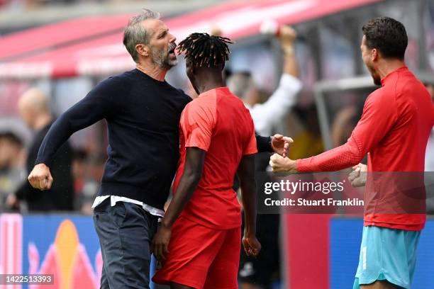 Marco Rose, Head Coach of RB Leipzig celebrates after Dominik Szoboszlai scoring their team's second goal during the Bundesliga match between RB...