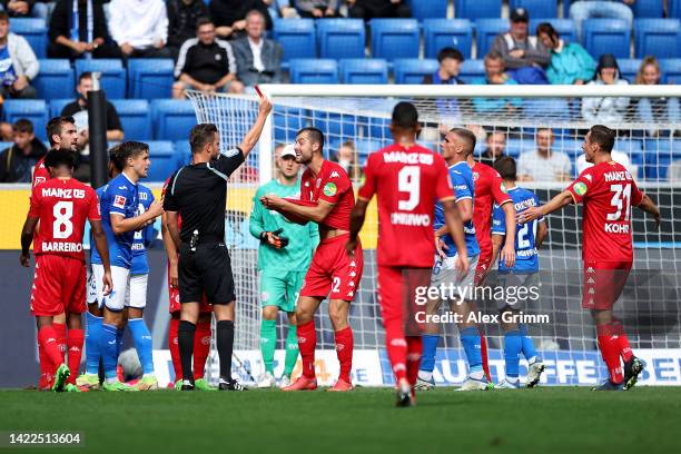 Alexander Hack of FSV Mainz is shown a red card by referee Daniel Schlager during the Bundesliga match between TSG Hoffenheim and 1. FSV Mainz 05 at...