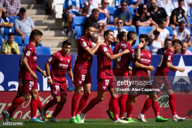 Erik Lamela of Sevilla FC celebrates with teammates after scoring the opening goal during the LaLiga Santander match between RCD Espanyol and Sevilla...