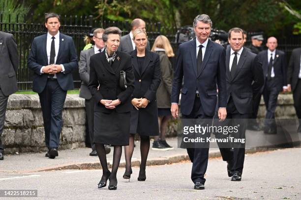 Anne, Princess Royal, Zara Tindall and Timothy Laurence greet the public outside the gates of Balmoral Castle on September 10, 2022 in Aberdeenshire,...