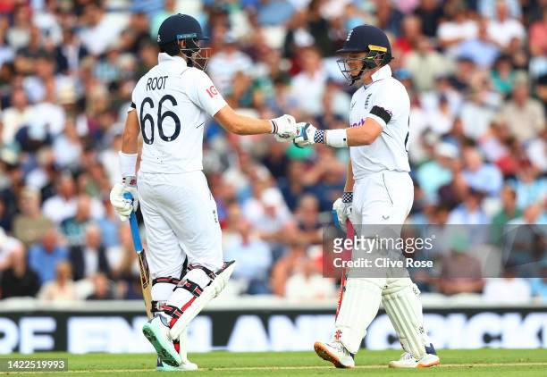 Joe Root embraces Ollie Pope of England as they bat during Day Three of the Third LV= Insurance Test Match between England and South Africa at The...
