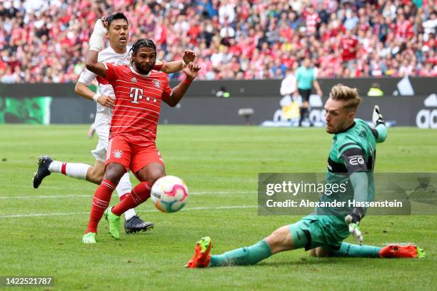 Serge Gnabry of Bayern Munich has a shot saved by Florian Muller of VfB Stuttgart during the Bundesliga match between FC Bayern Muenchen and VfB...