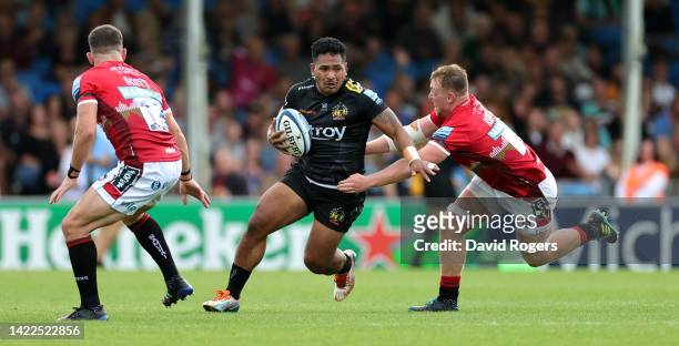 Solomone Kata of Exeter Chiefs is tackled by past Tommy Reffell as Jimmy Gopperth looks on during the Gallagher Premiership Rugby match between...
