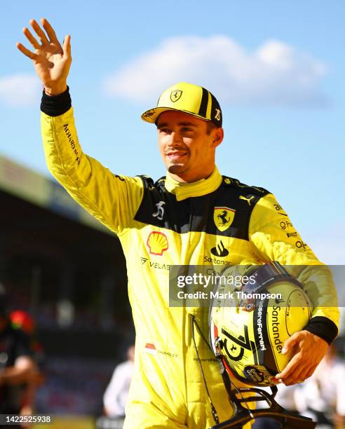 Pole position qualifier Charles Leclerc of Monaco and Ferrari waves to the crowd during qualifying ahead of the F1 Grand Prix of Italy at Autodromo...