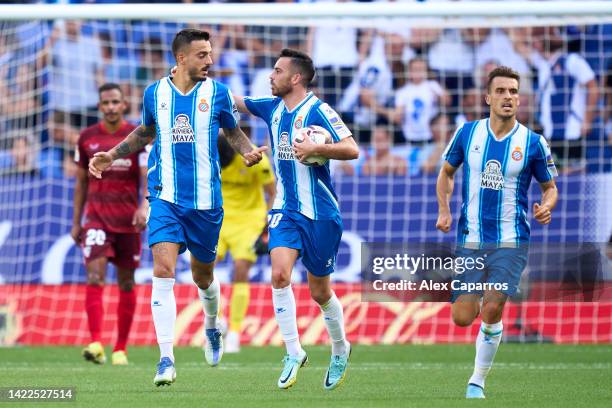 Jose Luis Mato 'Joselu' of RCD Espanyol is congratulated by Eduardo 'Edu' Exposito after scoring their team's first goal with a penalty kick during...