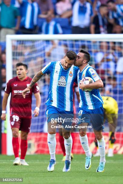 Jose Luis Mato 'Joselu' of RCD Espanyol is congratulated by Eduardo 'Edu' Exposito after scoring their team's first goal with a penalty kick during...