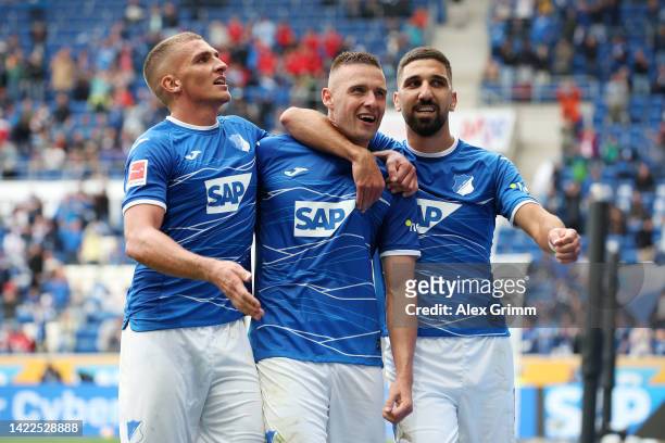 Pavel Kaderabek of TSG Hoffenheim celebrates with teammates after scoring their team's fourth goal during the Bundesliga match between TSG Hoffenheim...