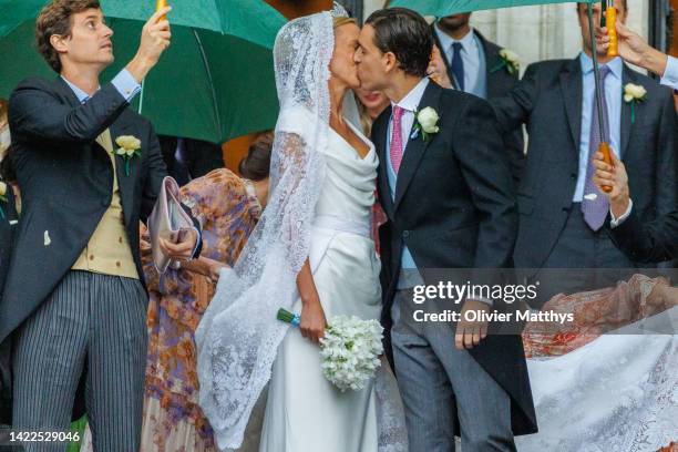 Princess Maria-Laura of Belgium and William Isvy kiss as the leave the Cathedral of St. Michael and St. Gudula after the wedding ceremony on...