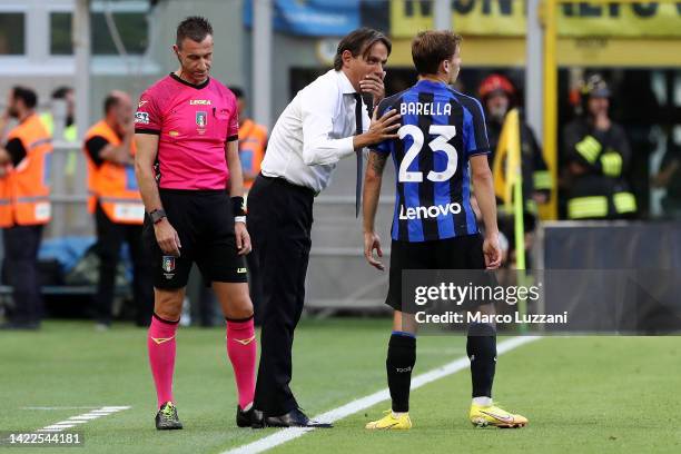 Simone Inzaghi, Head Coach of FC Internazionale interacts with Nicolo Barella of FC Internazionale during the Serie A match between FC Internazionale...