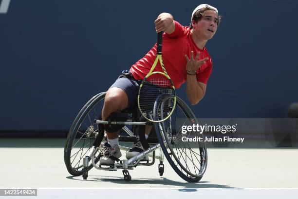 Dahnon Ward of Great Britain serves against Ben Bartram of Great Britain during their Junior Boy's Wheelchair Singles Final match on Day Thirteen of...