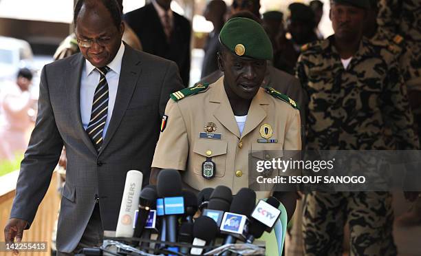 Malian junta leader, Captain Amadou Sanogo , and Burkina Faso's foreign Minister Djibrill Bassole arrive to make a declaration at the Kati military...