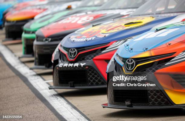 Detail view of the cars parked on the grid during practice for the NASCAR Cup Series Hollywood Casino 400 at Kansas Speedway on September 10, 2022 in...