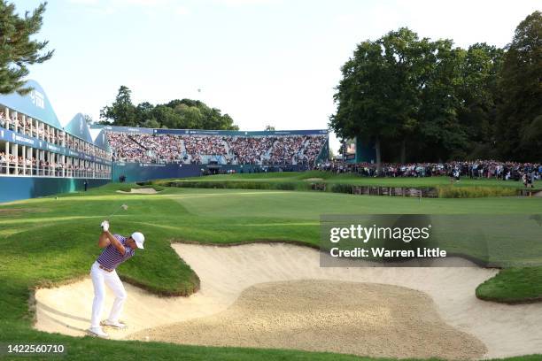 Billy Horschel of The United States plays their third shot out of the bunker on the 18th hole during Round Two on Day Three of the BMW PGA...