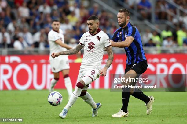 Sasa Lukic of Torino FC is challenged by Stefan de Vrij of FC Internazionale during the Serie A match between FC Internazionale and Torino FC at...