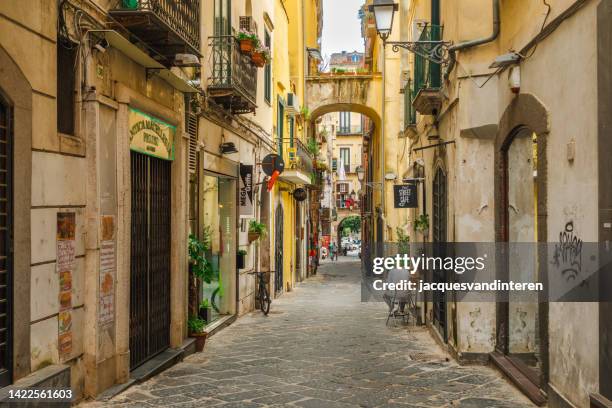 a narrow, rustic and colourful alley in the centre of salerno, italy - salerno stockfoto's en -beelden