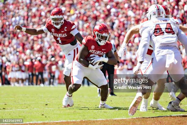 Jefferson hands off the ball to Rashod Dubinion of the Arkansas Razorbacks for a touchdown in the first half of a game against the South Carolina...