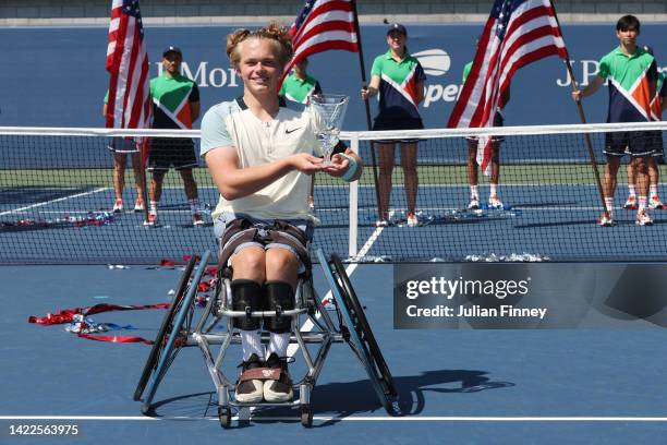 Ben Bartram of Great Britain celebrates with the championship trophy after defeating Dahnon Ward of Great Britain during their Junior Boy's...