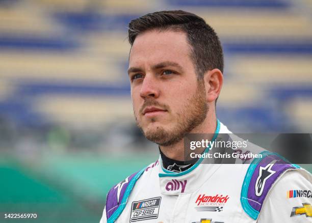 Alex Bowman, driver of the Ally Chevrolet, walks the grid during practice for the NASCAR Cup Series Hollywood Casino 400 at Kansas Speedway on...