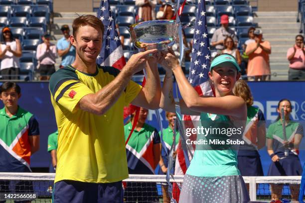 Storm Sanders of Australia and John Peers of Australia celebrate with the championship trophy after defeating Kirsten Flipkens of Belgium and Edouard...